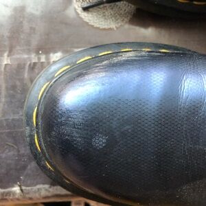 there are  spotsfrom  dust;  a shoe wax  would probably work to remove spots